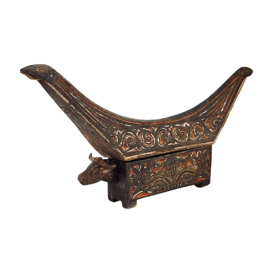 Traditional Indonesian Toraja Water Buffalo Vessel: Vintage Toraja wooden vessel with water buffalo head and lid that mimics the roof shape of the Toraja Tongkonan house. Measures 9" x 18" x 2 3/8".