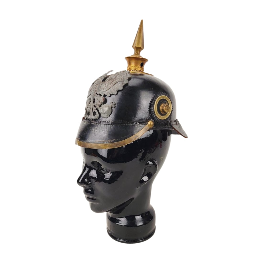 Imperial German Prussian Pickelhaube Spike Military Helmet: Hardened leather with metal fittings German Military spike helmet. Model head not inlcuded. Measure 9 3/8" x 10" x 6".