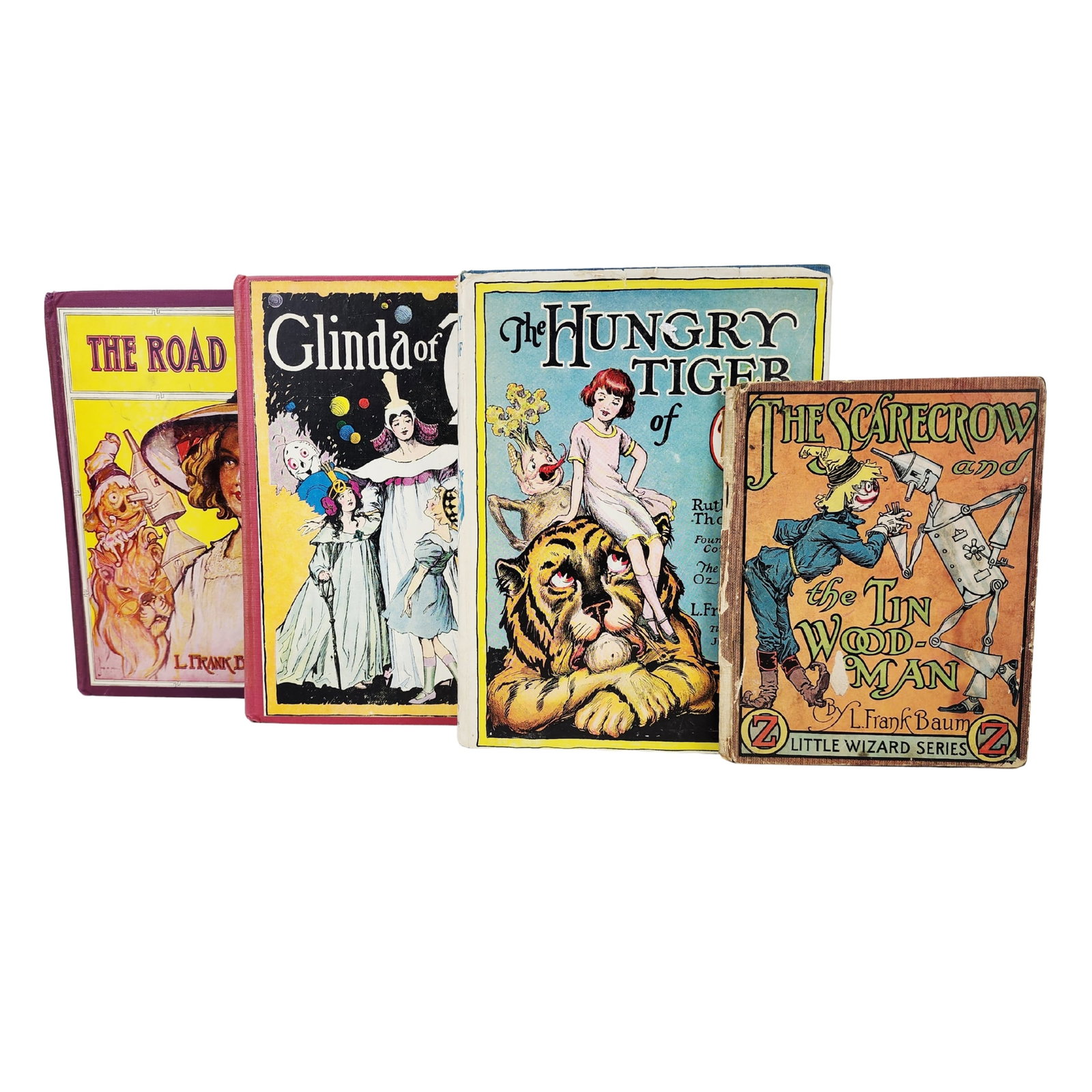Vintage Wizard of Oz Theme Books: Group of antique Wizard of Oz theme books including, Road to OZ, Glinda of OZ, The Hungry Tiger of OZ, The Scarecrow & Tinman of OZ. Measures 7" to 9 3/8".