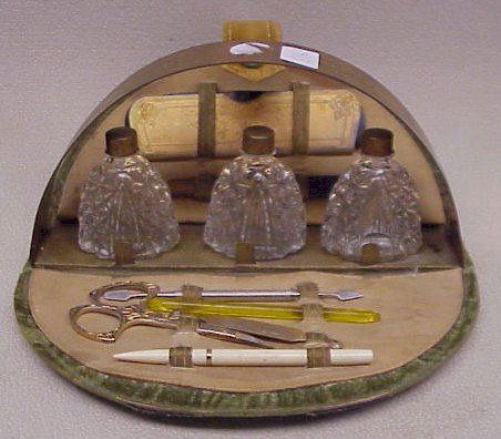Art Deco Manicure Set-Perfume Bottles: Art Deco Manicure Set-containing 9 pieces including Perfume Bottles. Case composed of velvet and etched brass. Most tools also with brass wash. 1 tool marked Griffin. Very Good condition, case is inta