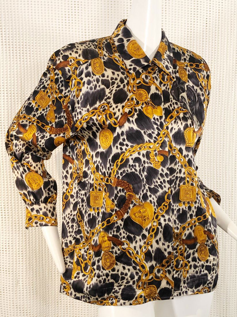 Escada Silk Blouse In Dog & Charm Novelty Print: Escada by Margaretha Ley silk button down blouse in a chain, charm and dog novelty print. See coordinating bomber jacket listed. Marked size 40.