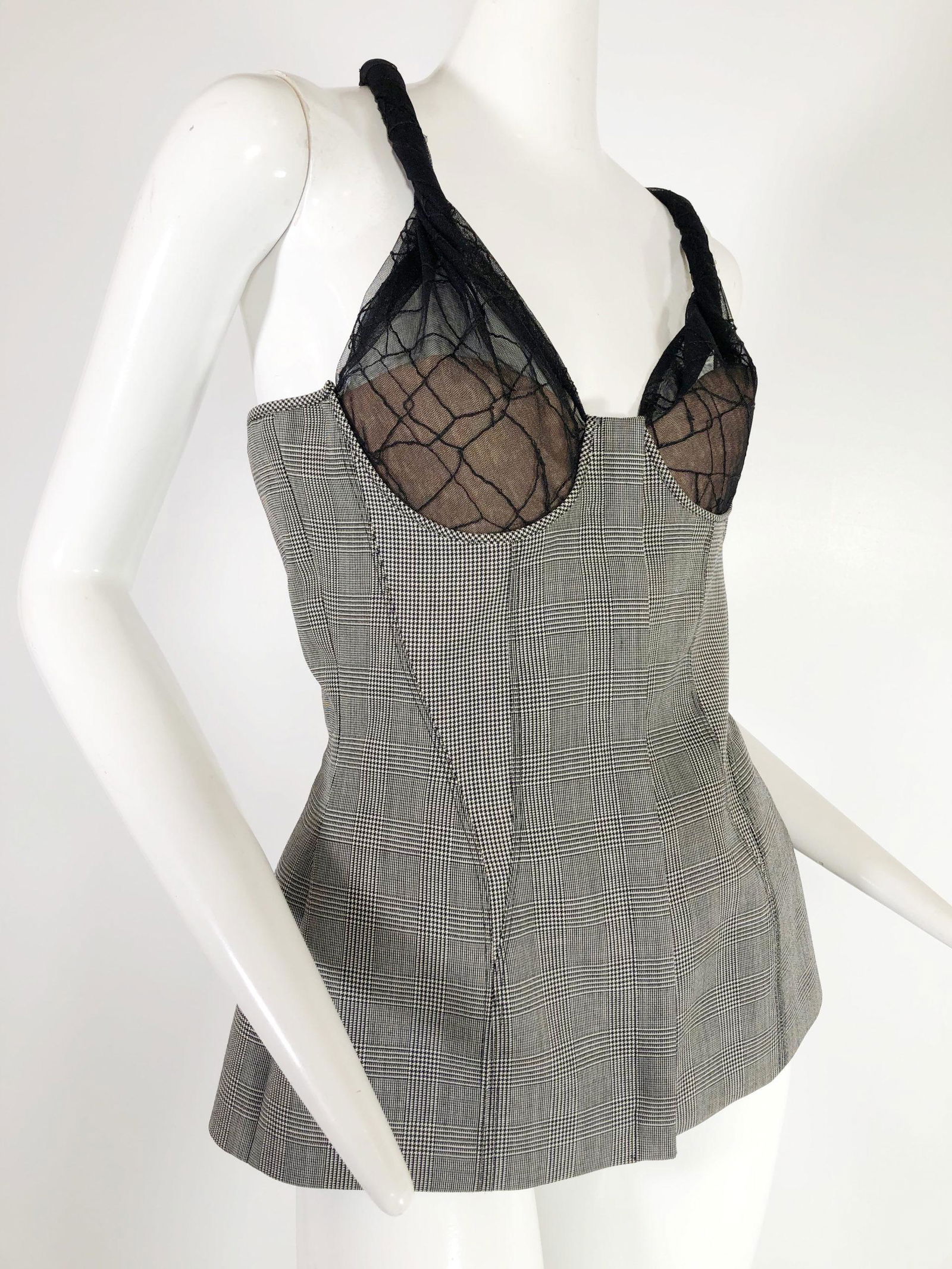 Gianni Versace Hounds-tooth Bustier w/ Strap: Gianni Versace Hounds-tooth boned bustier with asymmetrical net strap. Net covered bust pads create nude effect. Zipper at center front. Marked 44 fits a US size medium. See measurement card for exact