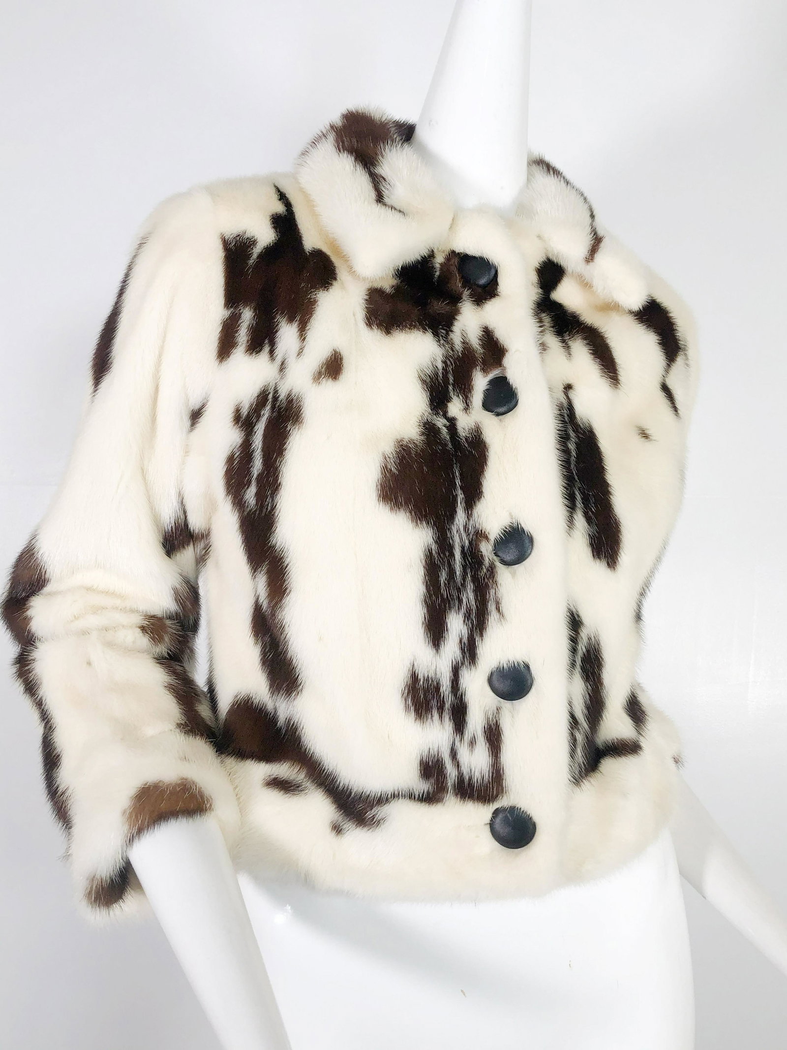 1960 Cecilia Ying Cream and Brown Mink Crop Jacket: 1960 Cecilia Ying cream and brown fur crop jacket with black buttons. One small internal pocket. Dark brown and cream fur. Black buttons. Fits a US 0-4. See measurement card for exact fit.