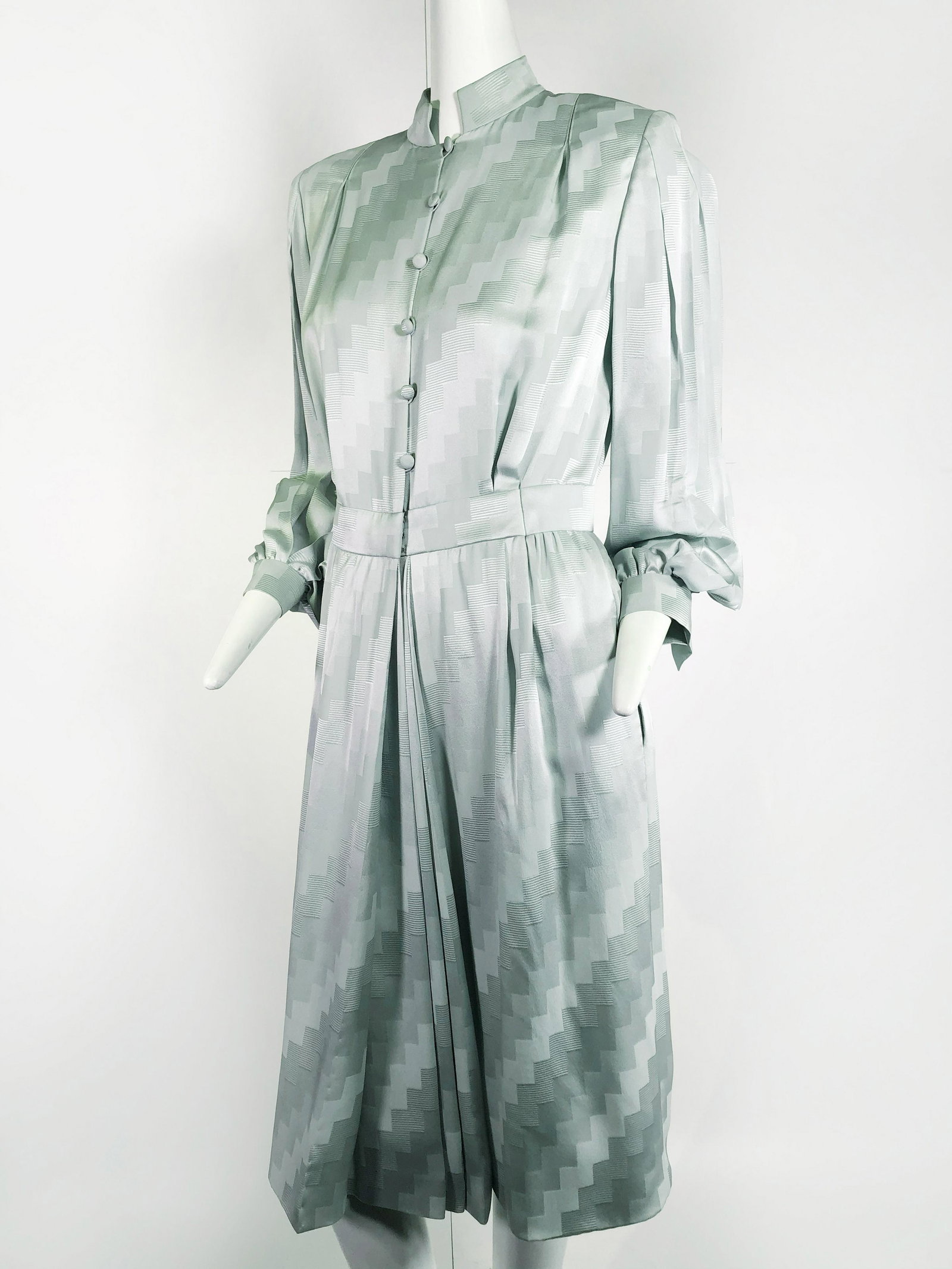 1980s Andre Laug Mint Green Silk Day Dress: 1980s Andre Laug pale mint green silk jacquard day dress with padded shoulders, covered buttons and full sleeves. Size 10.