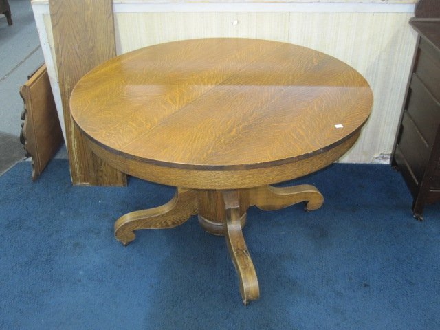 Antique Solid Oak Round Table: Solid oak round table measures 29"H x 45"W.Has 2 boards measuring 12"W. Good overall condition with wear consistent with age to boards.