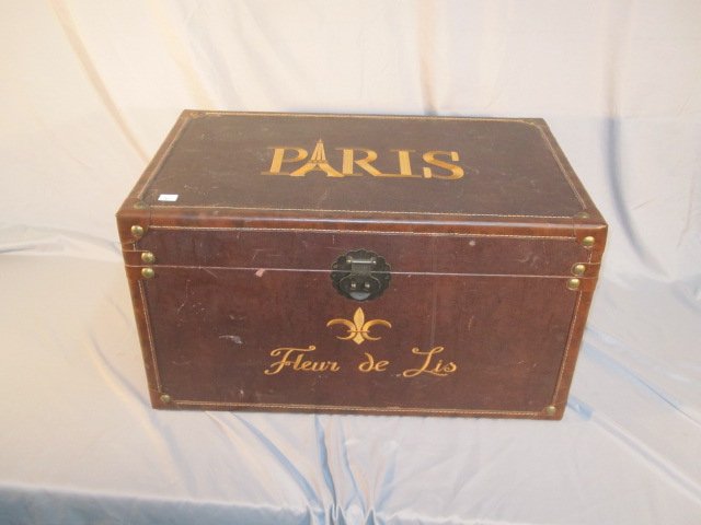 Leather Decorated Trunk: Quality contemporary trunk measures 23"W x 13"H x 14"D. Encased in leather and decorated in French style in good overall condition.