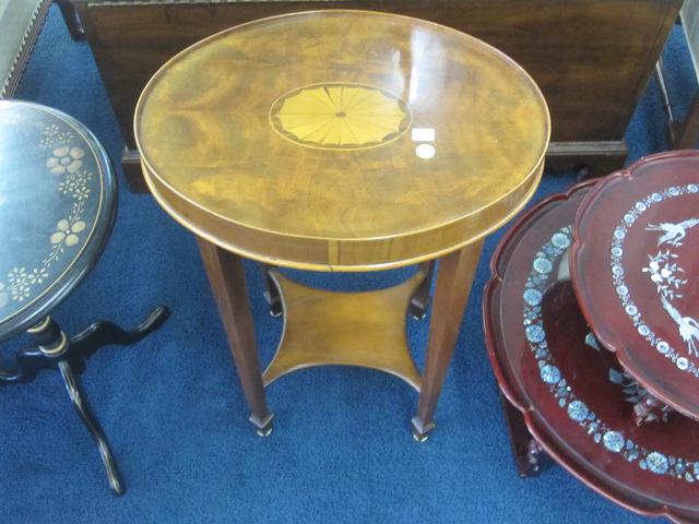 Oval Mahogany Stand with Inlay: Oval stand with center inlay. Stand measures 26"H x 17"W x 13"D. It is in very good condition.