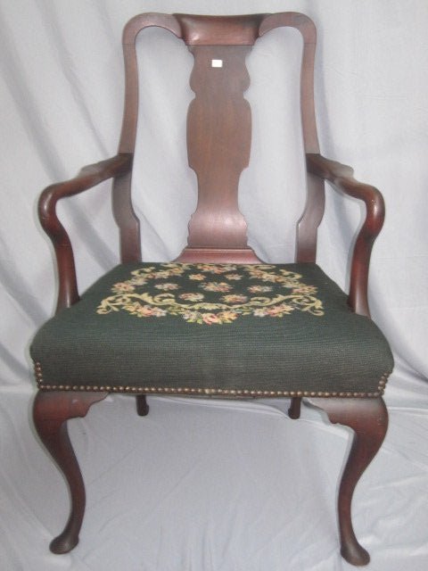 Mahogany Queen Anne Arm Chair: Vintage arm chair with needlepoint seat. Chair measures 40"H x 23"W x 20"D. Good condition with wear consistent age.