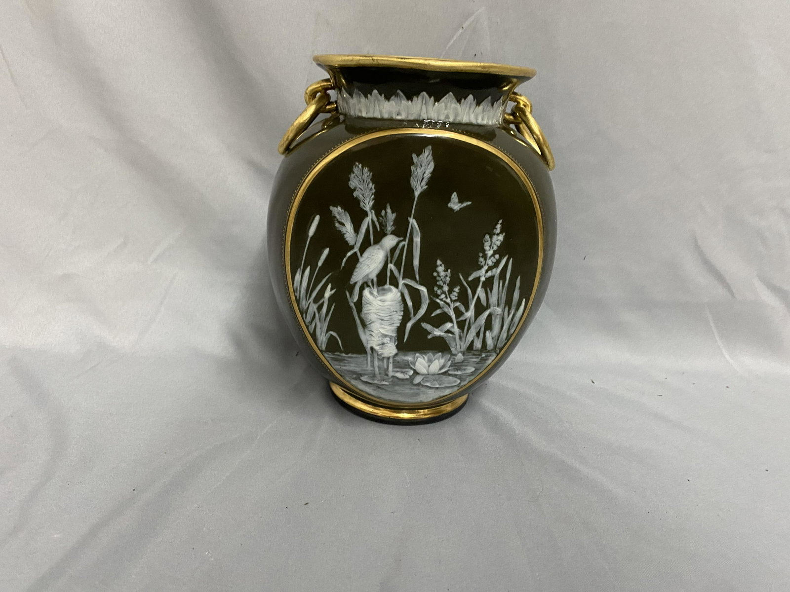 George Jones Majolica Pat Sur Pat Vase: 8"Hx7"W. Good condition. Very beatuiful piece of pottery.