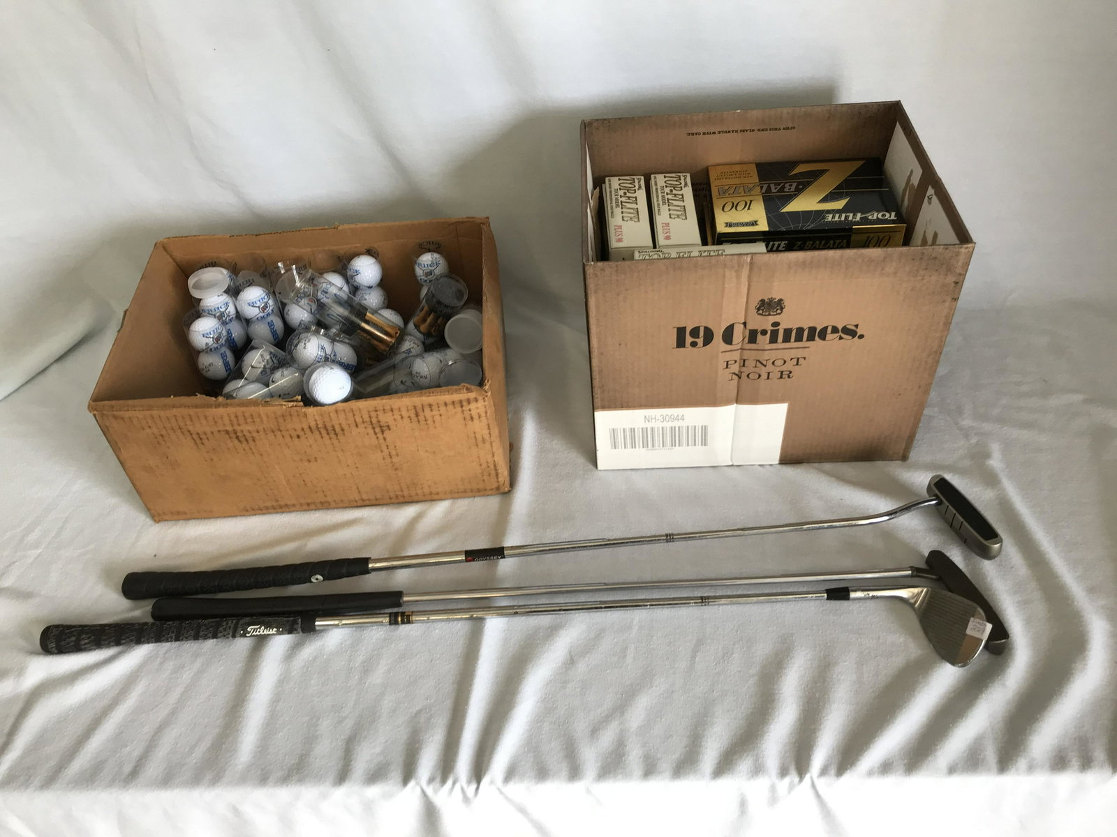 Golf Ball and Clubs: Assorted Golf balls and clubs