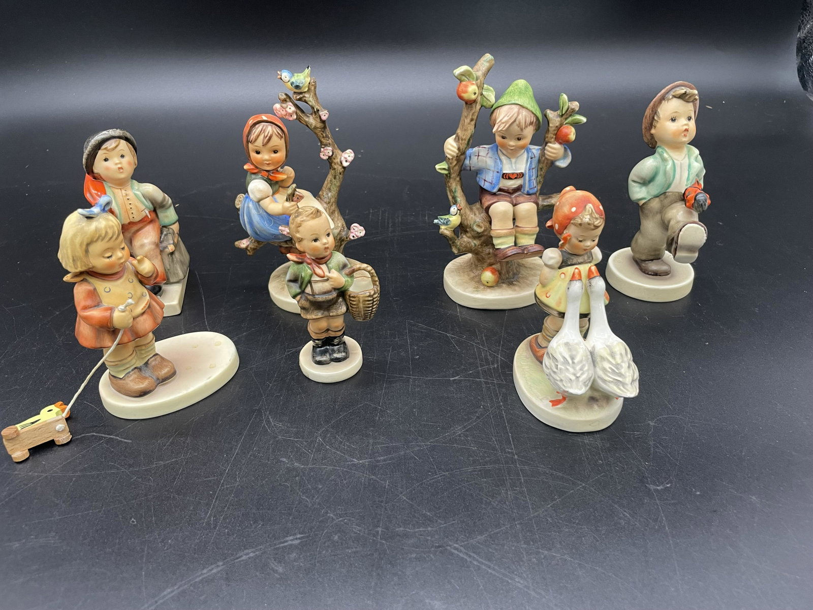 Grouping Of Hummels: Includes apple tree boy & girl. Largest is 5.5" H.