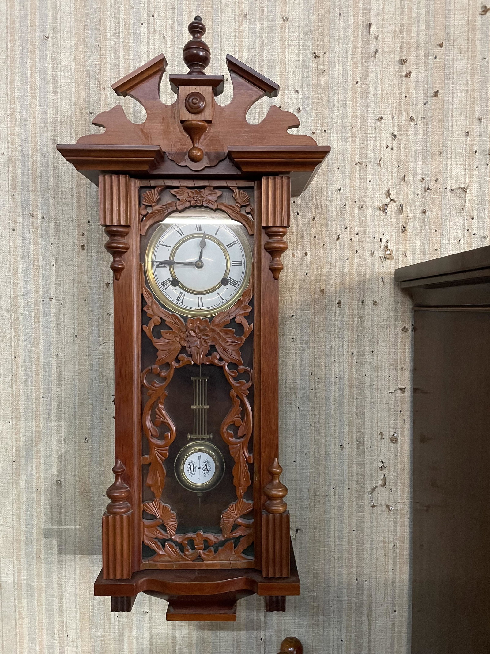 Carved Wall Clock: Includes key and pendulum. 32"x13".