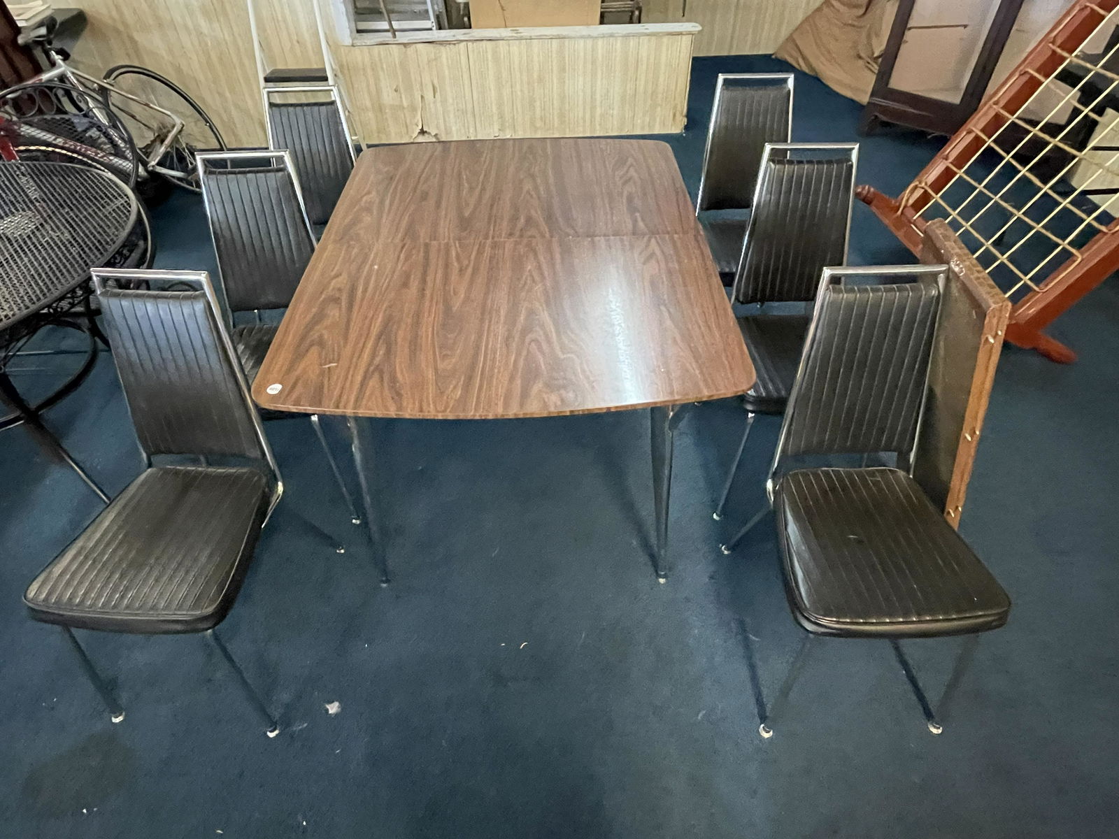 Mid Century Modern Table and Six Chairs: Table 30"x48" and chairs 36"x16". Includes two leaves.