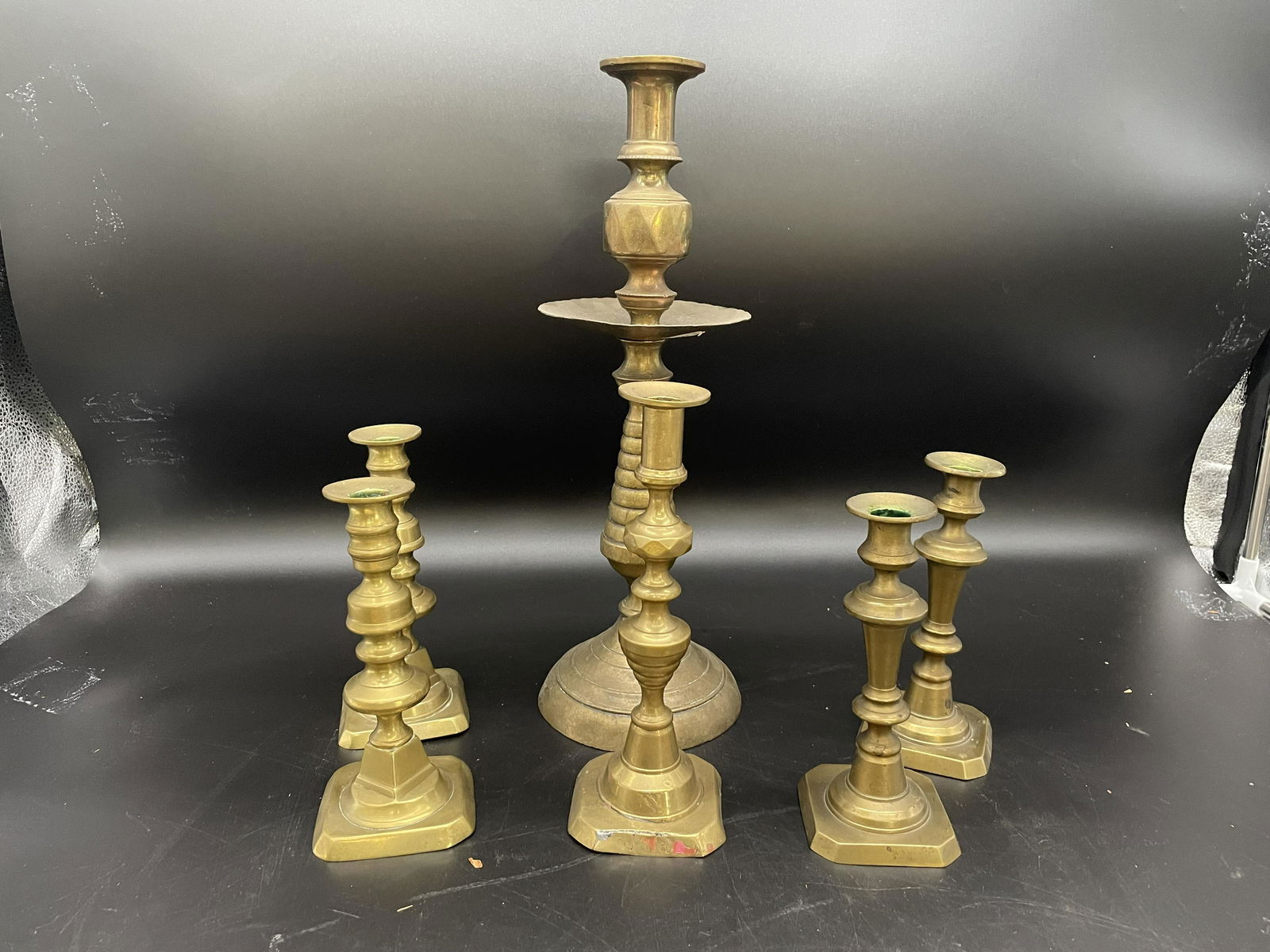 Collection Of Early Push Up Brass Candlesticks (1 of 3)