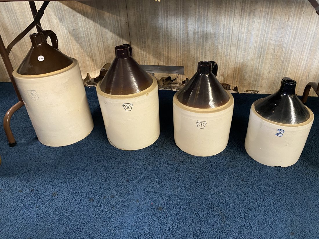 Set Of Four Pfatlzgraff Jugs: Largest is 21" H, smallest is 13" H.
