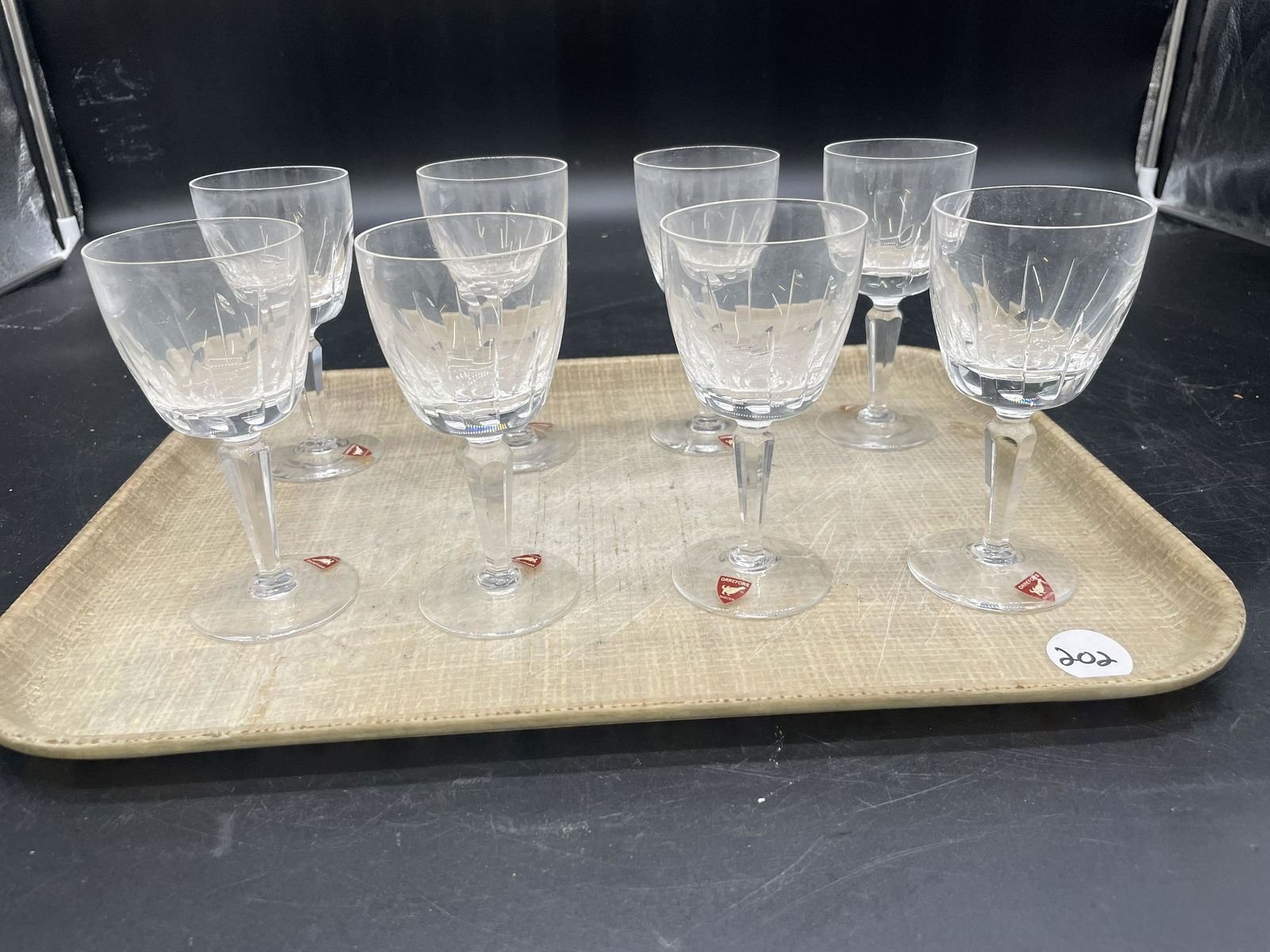 Eight Orrefors Cordials: original tags, signed. 5.25"H.