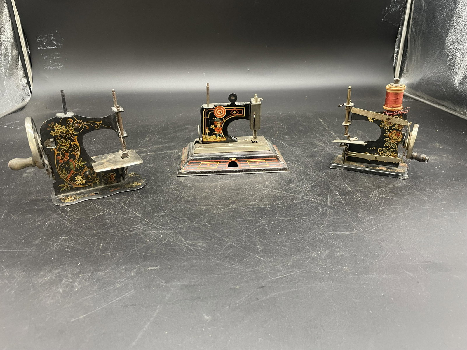 Three Childs Sewing Machines: all german, largest 6"W.