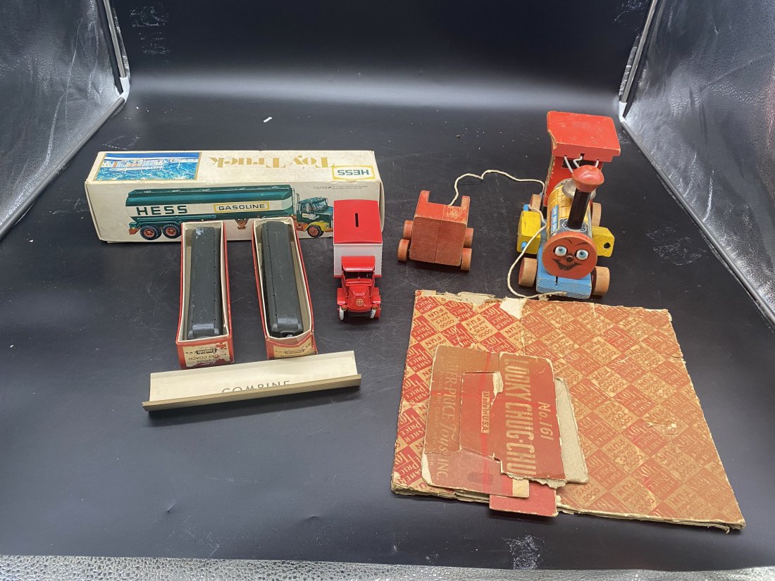 Vintage Toy Lot, Fisher Price: Includes Fisher Price Looky Chug-Chug Choo Choo train in original box. Vintage Hess truck Measures 15" x 4". 2 HO English train cars as is. in OB plus other toys.