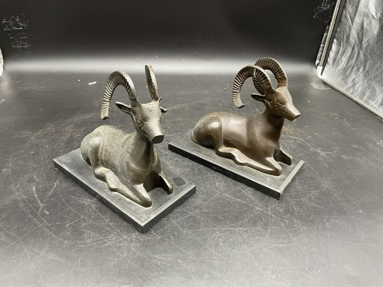 Pair Of Ram Bookends: Bronze rams on wooden base. Measure 9" x 7".