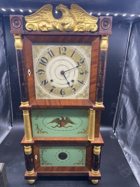 C & L Ives Empire Triple Decker Clock Circa 1830: measures 38" x 18" x 6". Has federal eagle painted on door. Bone escutcheons. Has key, pendulum & weights.