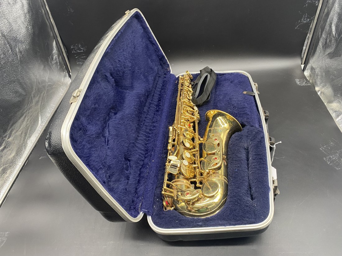 Brass Saxophone: Has original case & mouthpiece. Case measures 24" x 12" x 7".