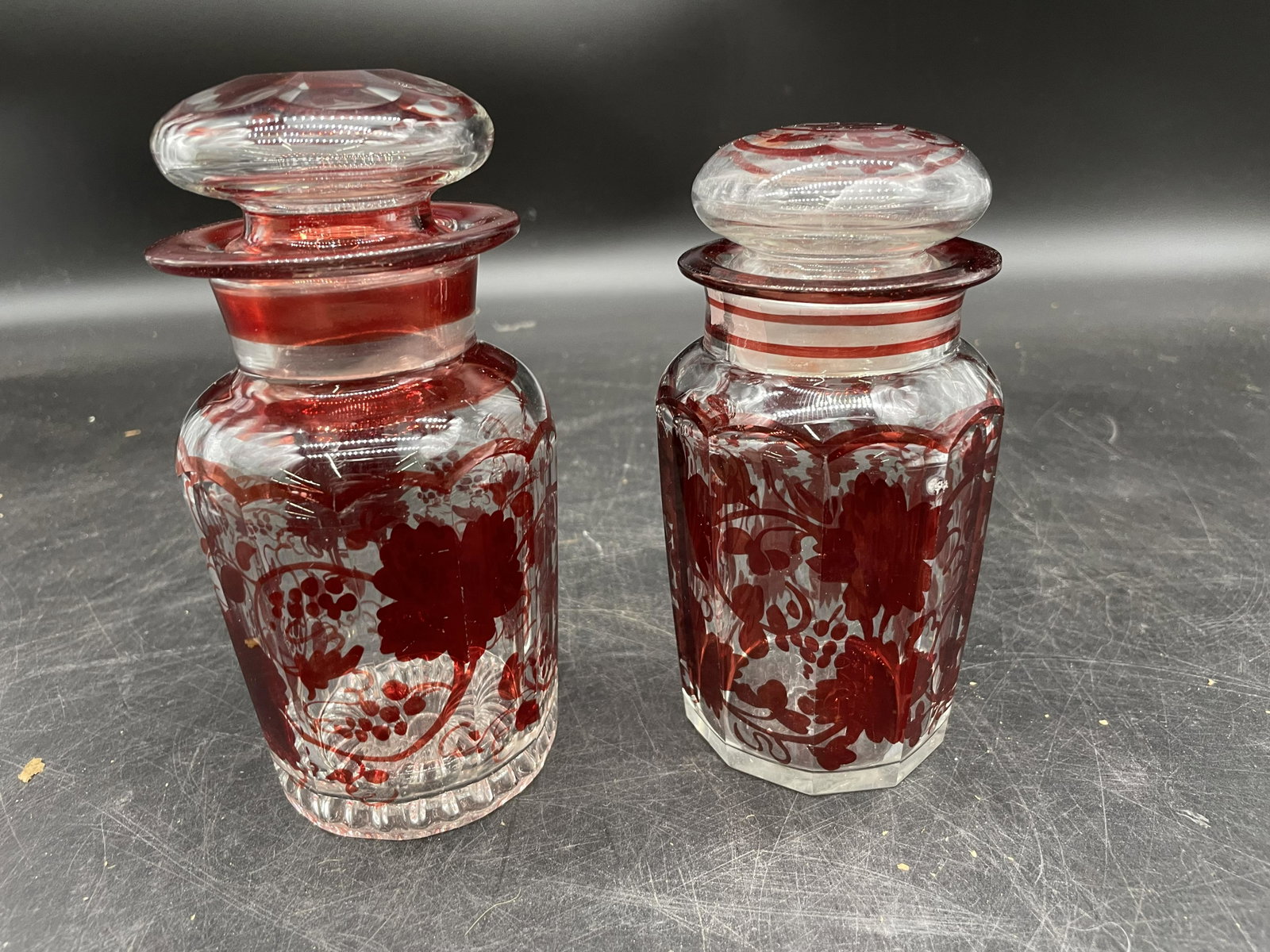 Two Bohemian Cut To Clear Jars: Largest measures 7" H.