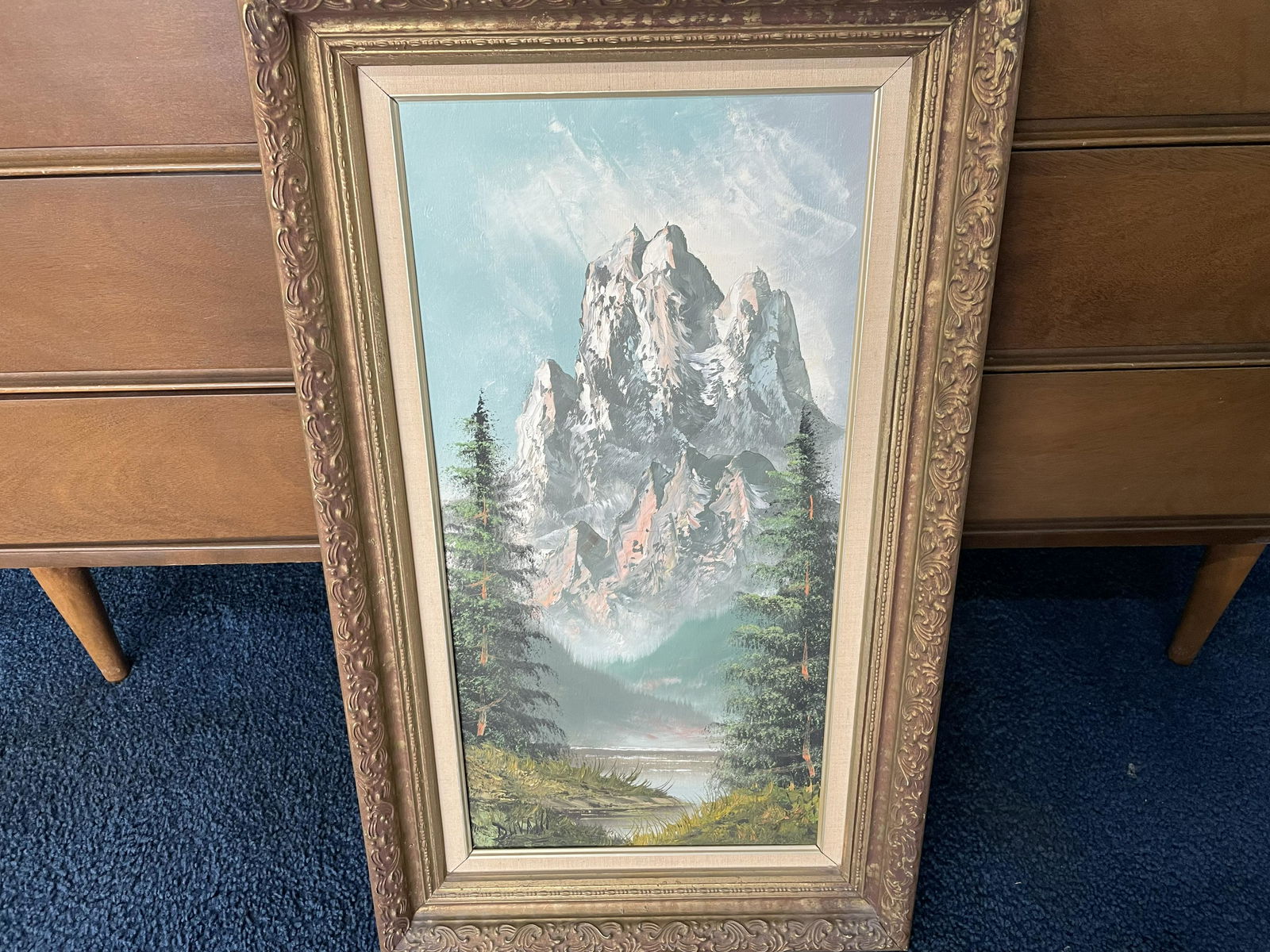 Oil on Canvas: SLL "Duvall", scene depicts mountain side, in gilt frame. 17"x30".