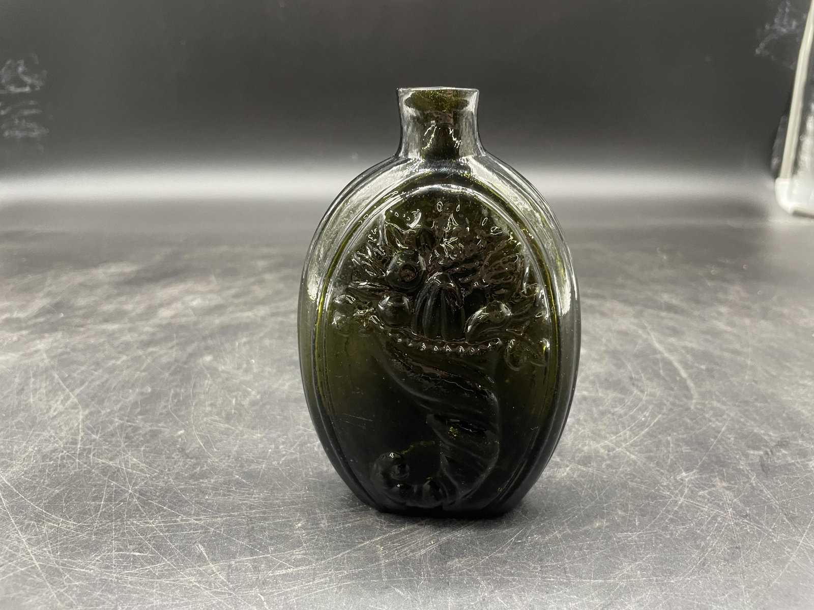 Ca. 1820 Forest Green Pontil Cornucopia Flask: rare color, ca. 1820, pontil on base, 6"H.