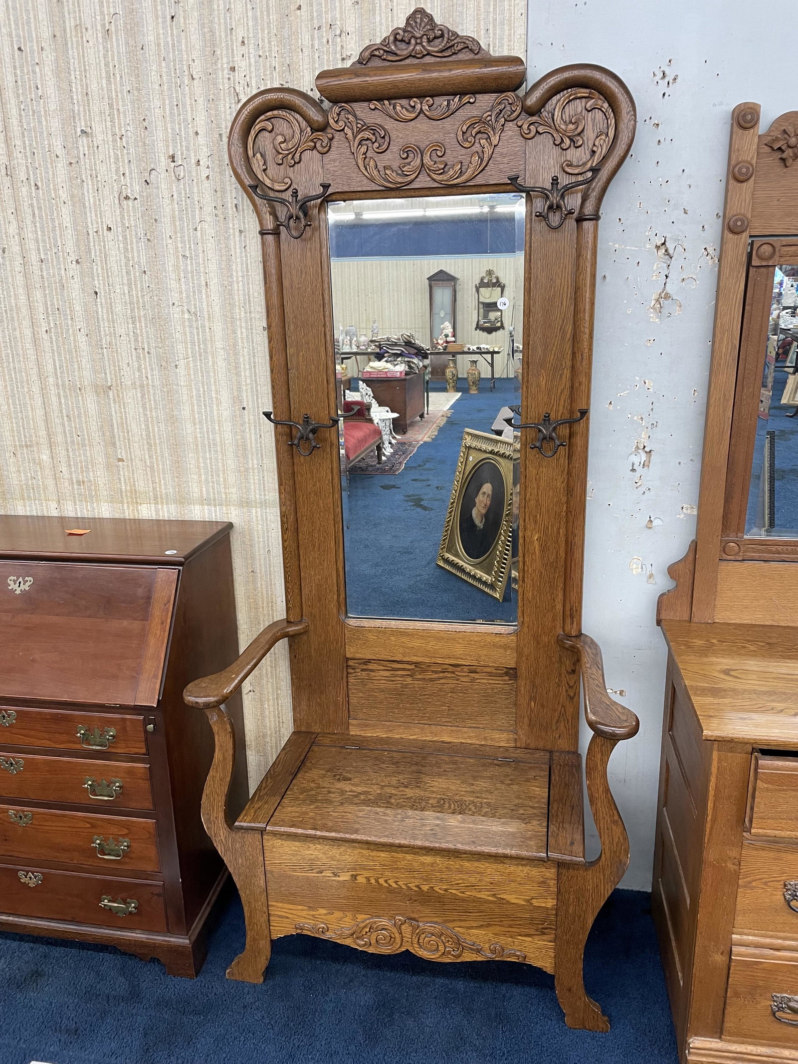 Antique Oak Carved Hall Seat: Ornate applied carvings, original hardware, beveled glass mirror. Measures 86" x 38" x 19".