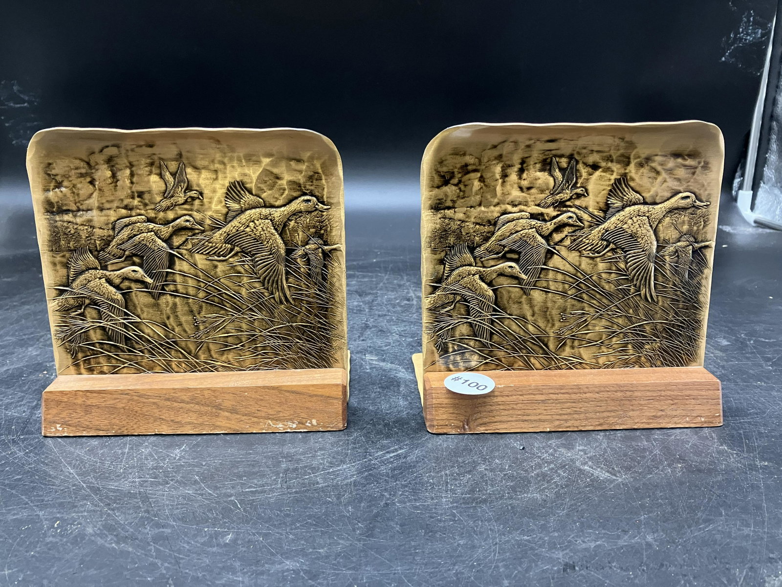 Bronze Bookends: Wildlife scene, stamped on base, sits on wooden base. 6"W.