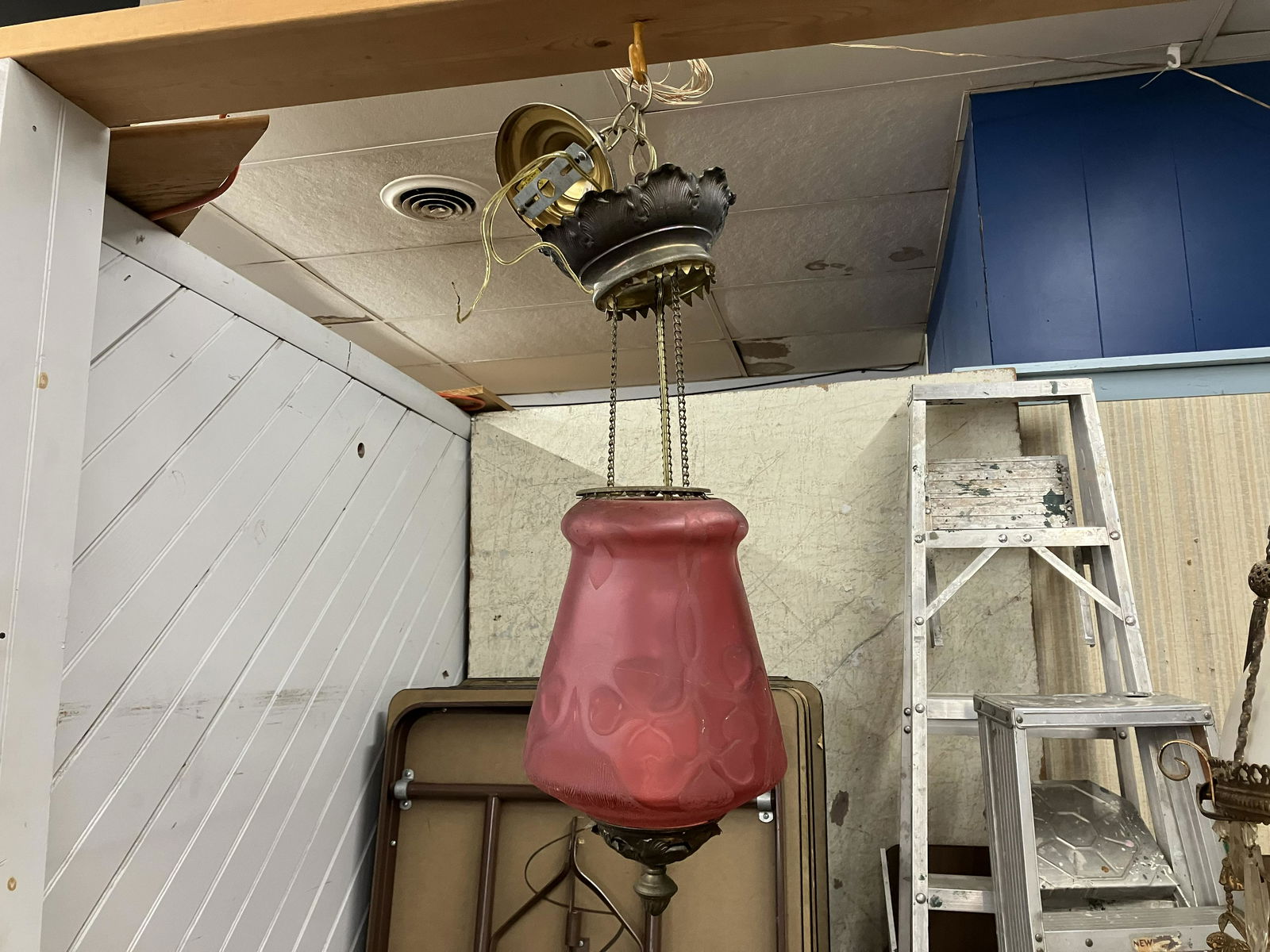 Antique Satin Glass Etched Hanging Light: Etched ruby shade. Measures 25" H. Adjustable frame.