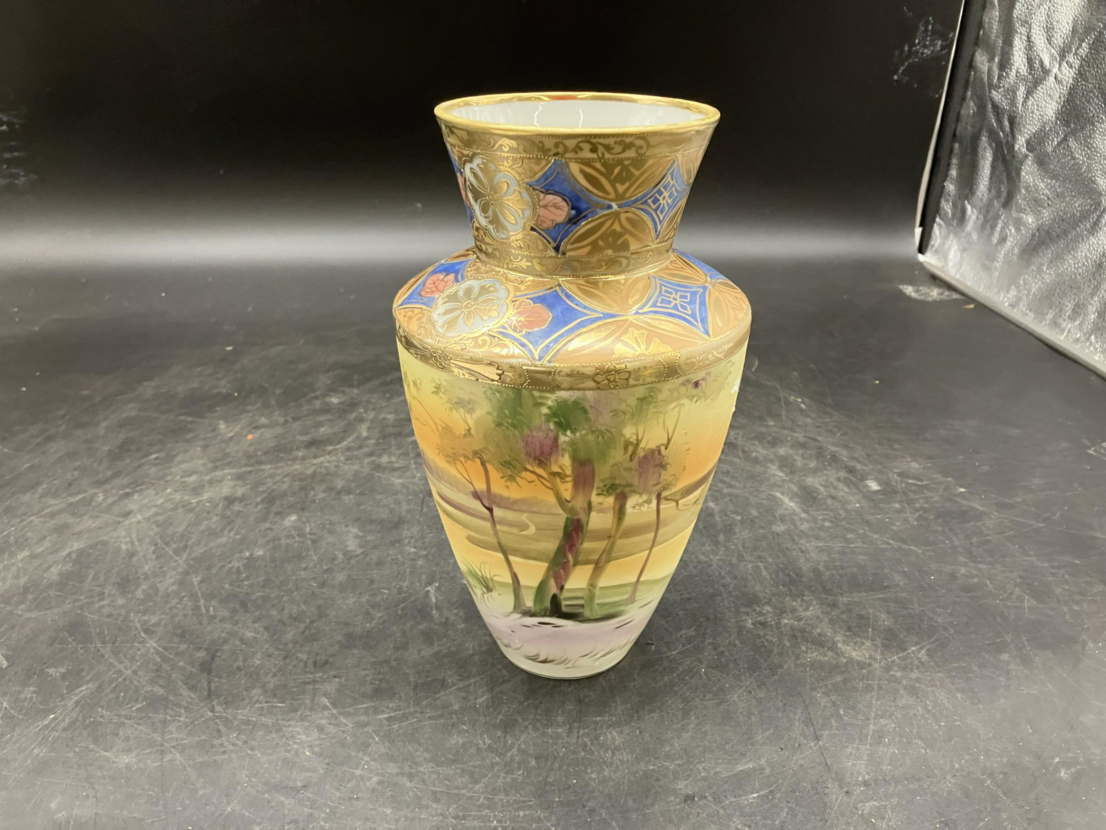Highly Decorated Nippon Vase: Highly decorated with cobalt & gold decoration. Measures 10" H.
