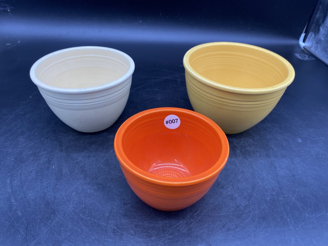 Three Fiesta Mixing Bowls: largest is 5"x8", smallest is 4"x 6"