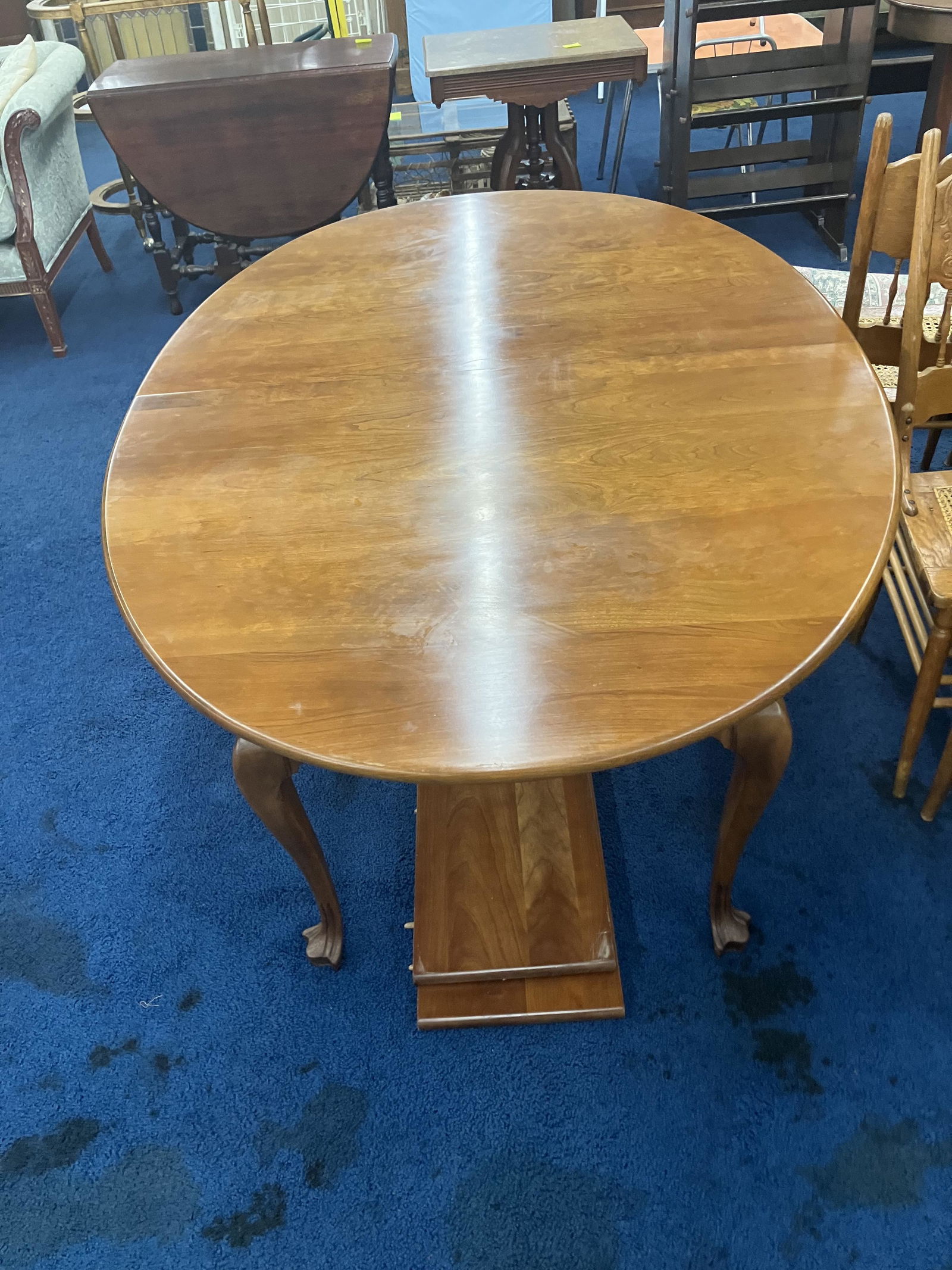 Statton Cherry Dining Room Table: Carved feet, two leaves. Measure 30" x 62" x 44". Came from suit that matches lots 90A, 128 and 190 but unsigned.