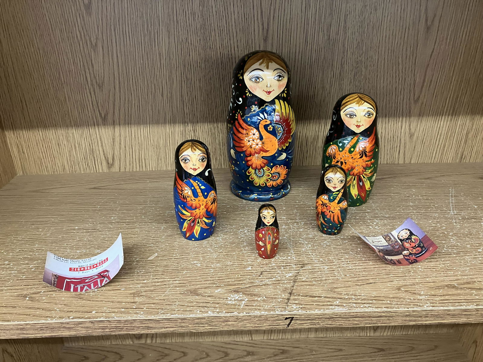 Grouping of Russian Nesting Dolls: Matching set of five, largest 7"H. Hand painted.