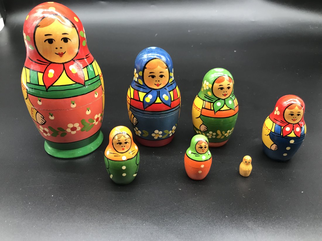 Grouping Of Russian Nesting Dolls: Matching set of 7, largest measures 6" H. Hand painted.