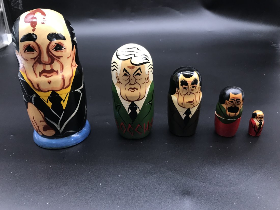 Grouping Of Russian Nesting Dolls: Russian leaders nesting doll set of 5, largest measures 7" H. Hand painted.