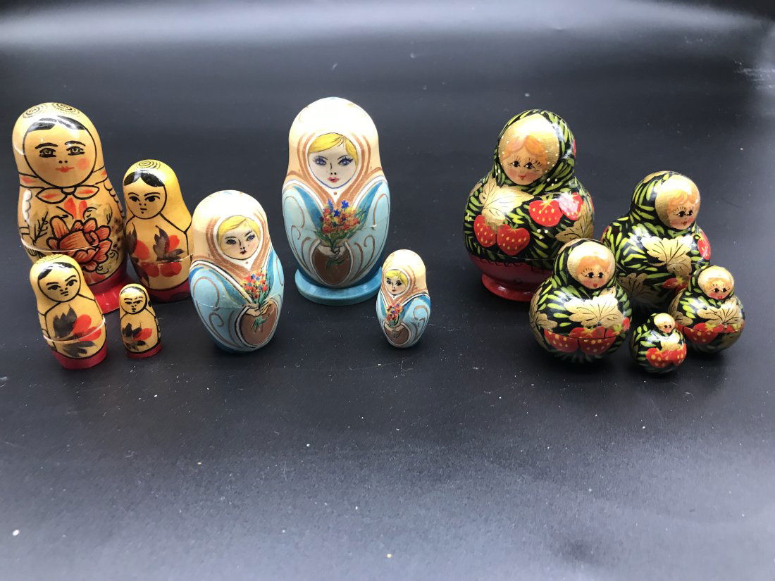 Three Sets Of Russian Nesting Dolls: Three sets of Russian nesting dolls. Sets of of five, four and three. Largest measures 3.5" H. Hand painted.