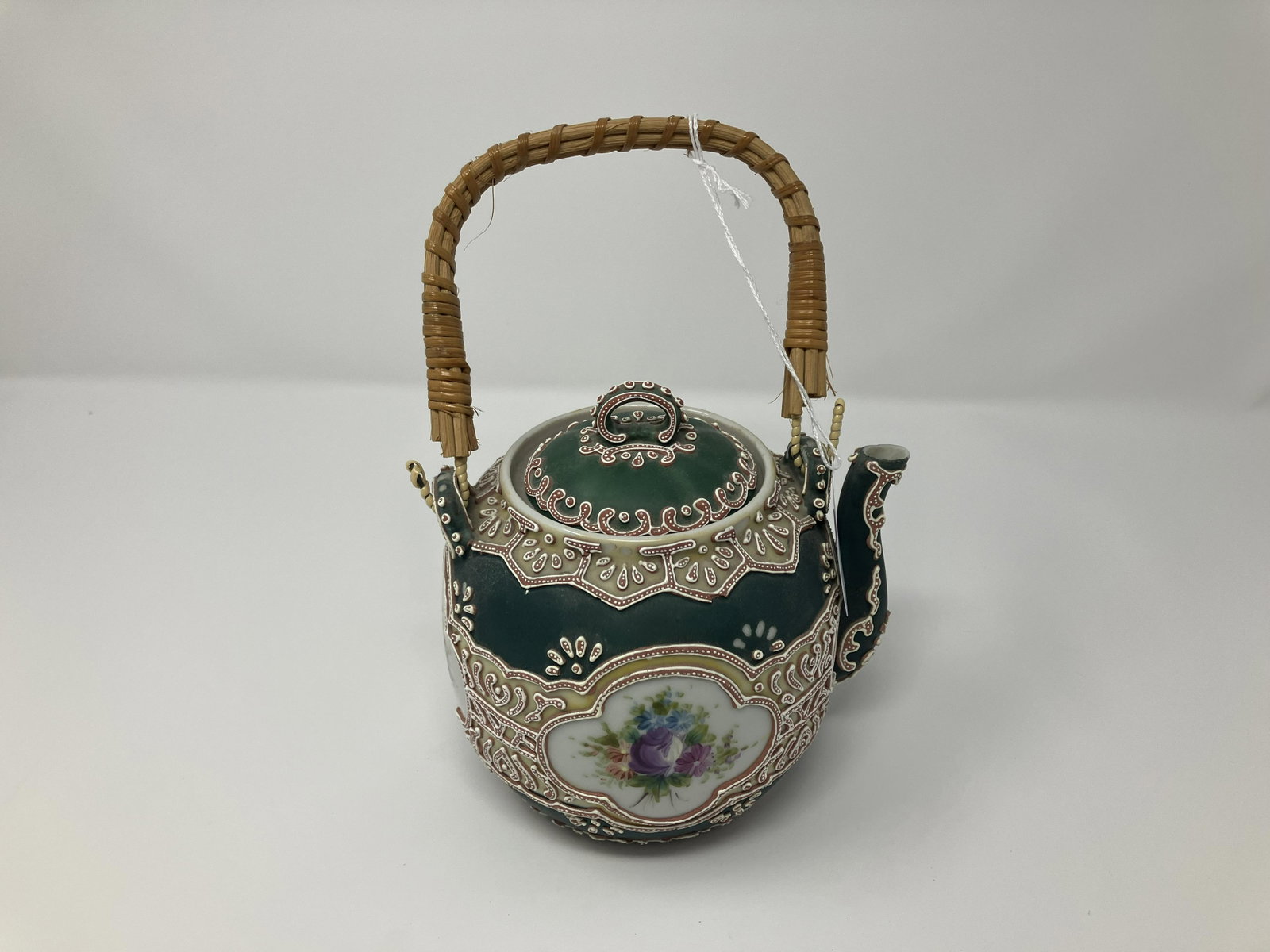 Nippon Moriage Teapot: hand decorated, wicker handle. 8"H.