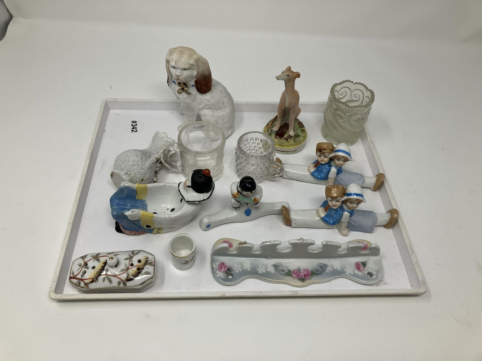 Knife Rest, Miniatures, Plus: Includes knife rest, miniatures, dog figure , bisque polar bear, bisque card desk holder, measures 6" x 1.5" W.