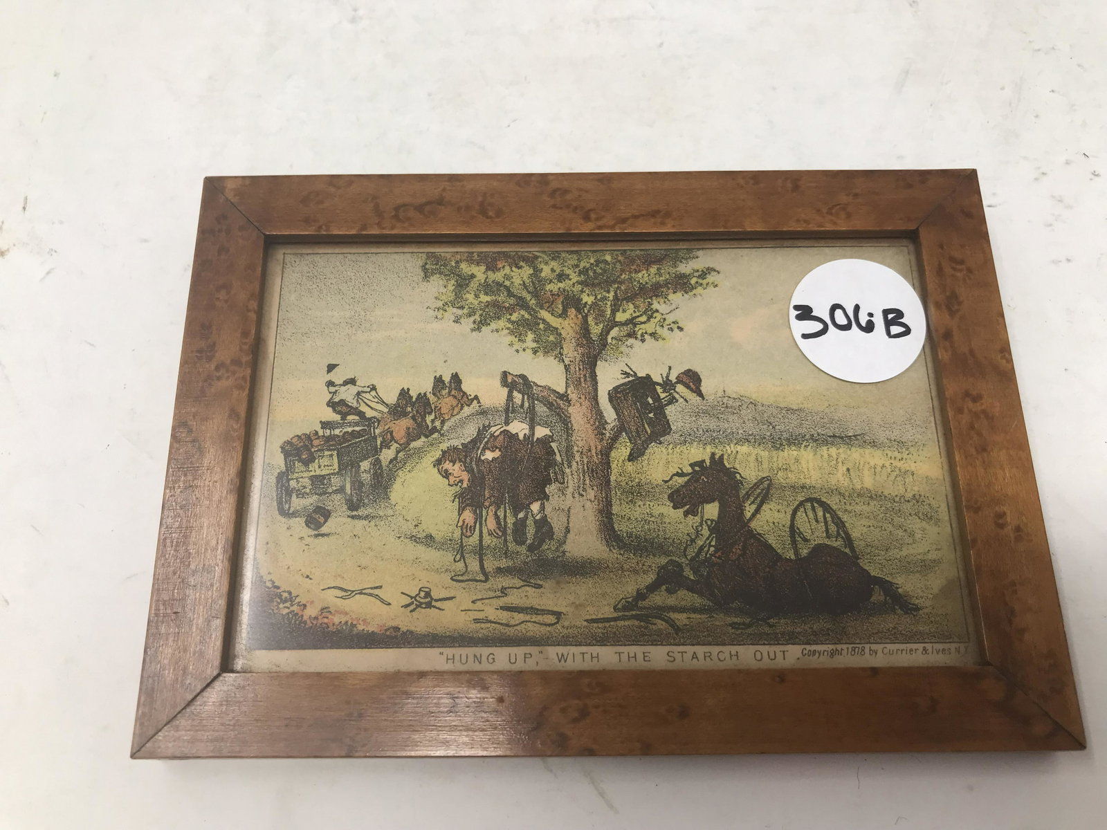 Original Currier & Ives: Titled " Hung Up with The Starch Out". Dated 1878. In tiger maple frame, measures 6" x 4".