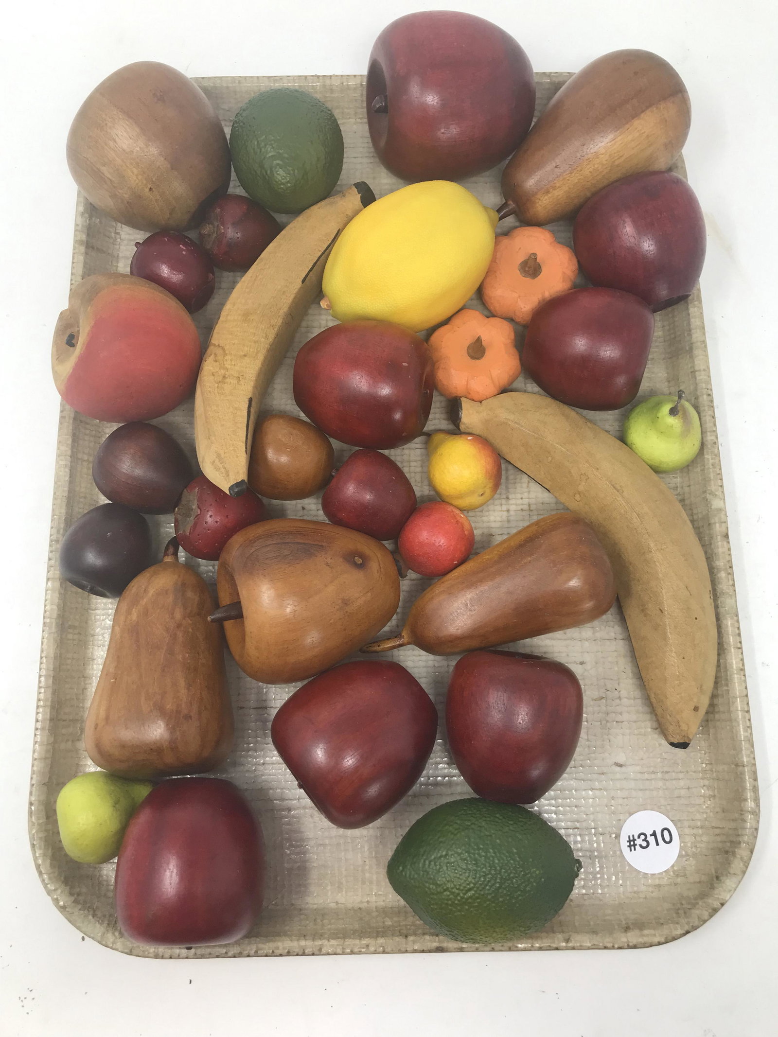 Lot of Wooden Fruit: Most are wooden. Lemon, limes small pears are not.
