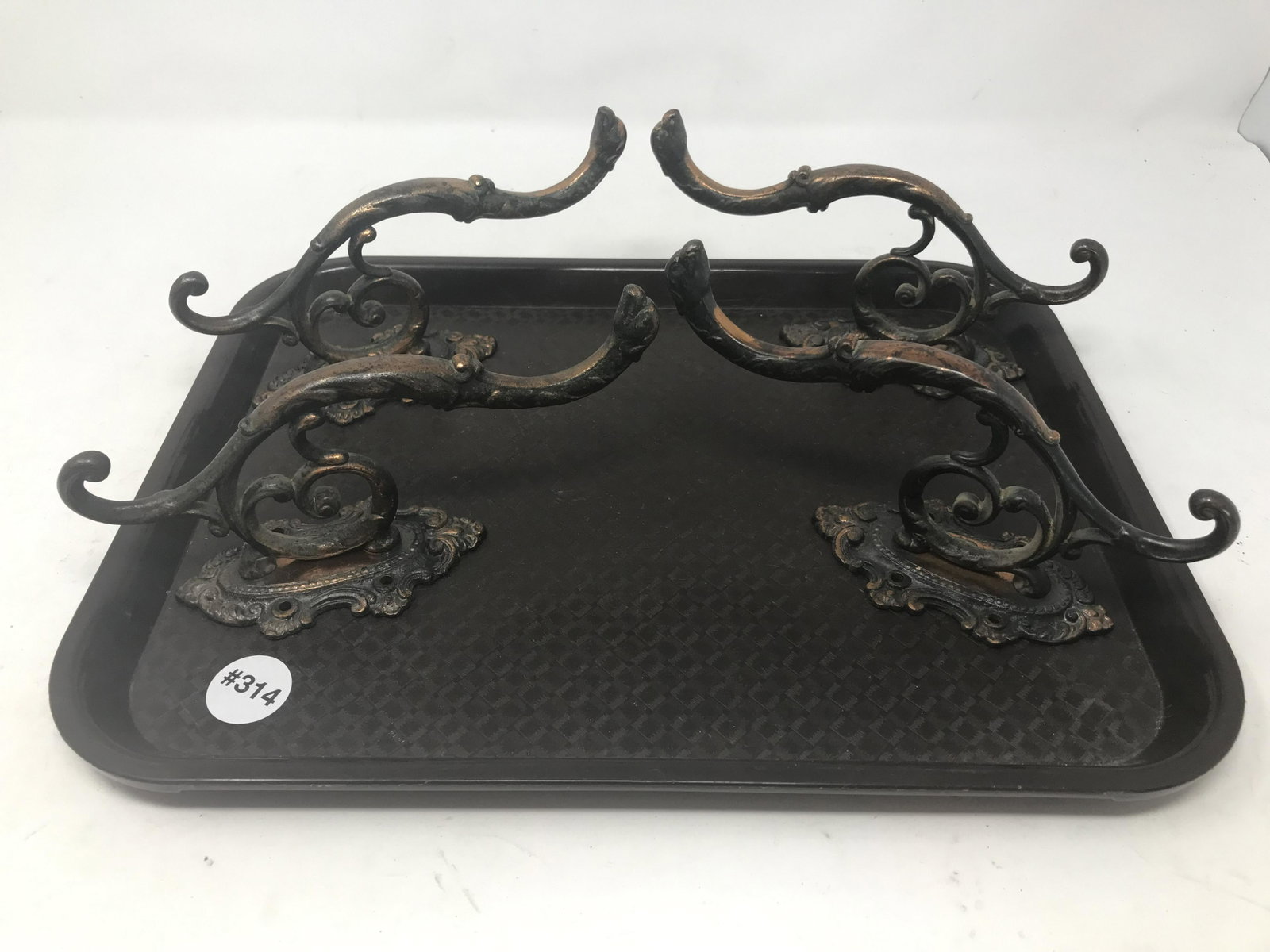 Antique Metal Hooks: Have animal heads, measure 7" x 3.5".