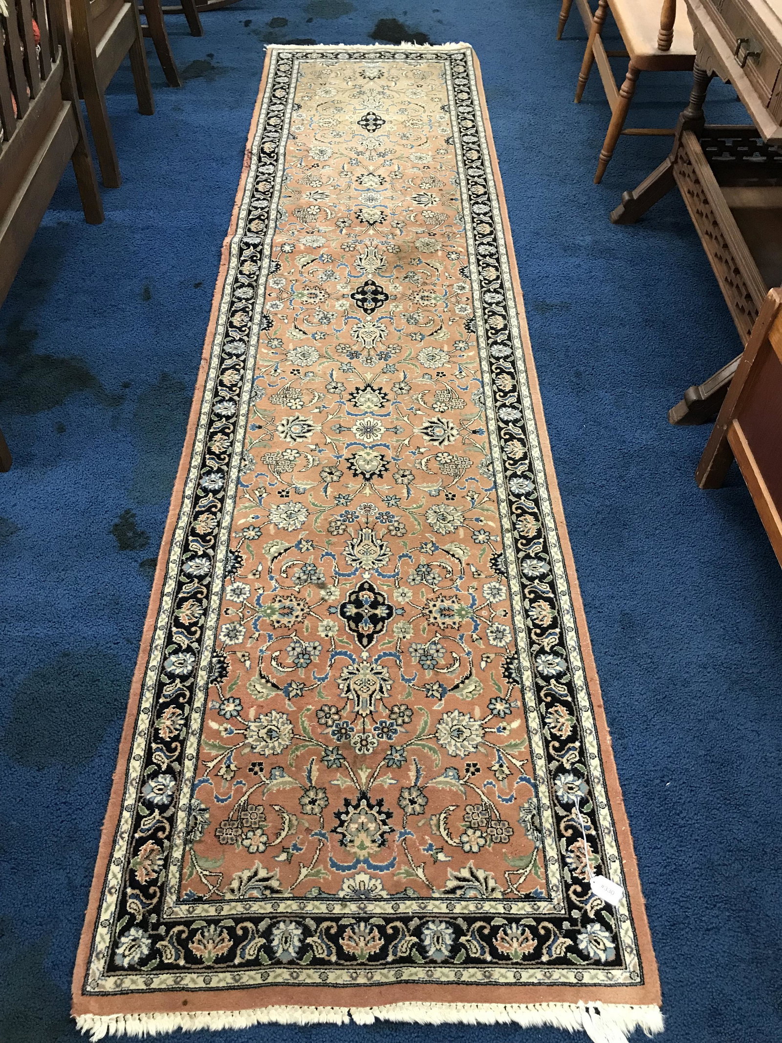 Oriental Runner: Measures 126" x 30". Hand knotted.