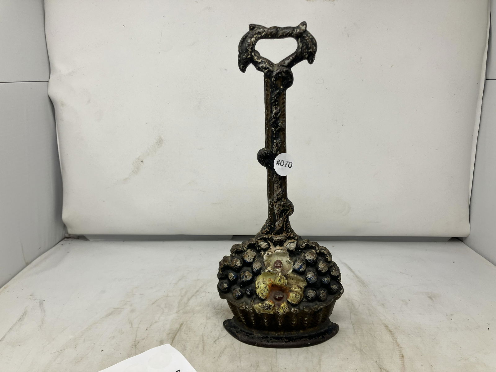 Cast Iron Doorstop: Basket of fruit. Measures 14" H.