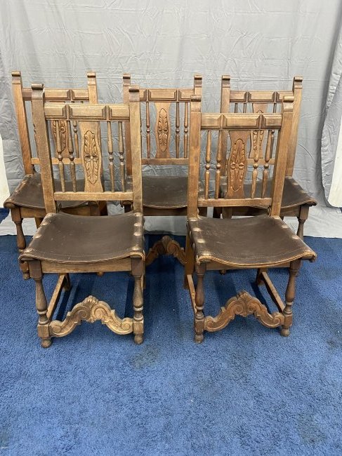 Five Oak Jacobean Carved Chairs: has original leather seats and tacks, 18"x14"x28". **This item is not eligible for in-house shipping.**