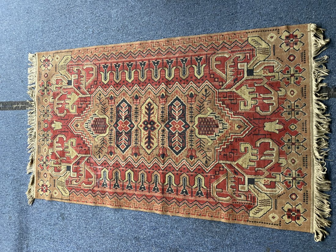 Oriental Carpet: 57" x 34".
