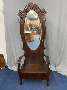 Antique Oak Hall Seat: 78" x 42" x 18". Has original matching hooks, oval beveled mirror and applied carvings.