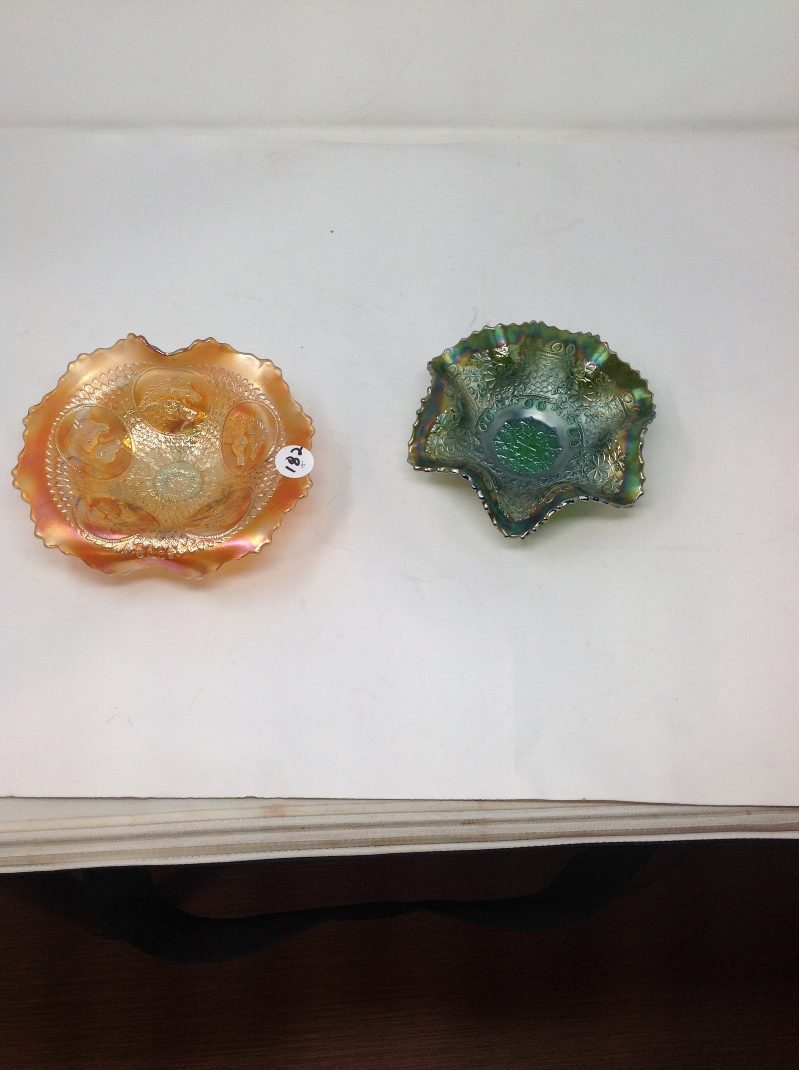 2 Pieces of Carnival Glass: Includes horse head bowl. Largest is 8 inches wide.