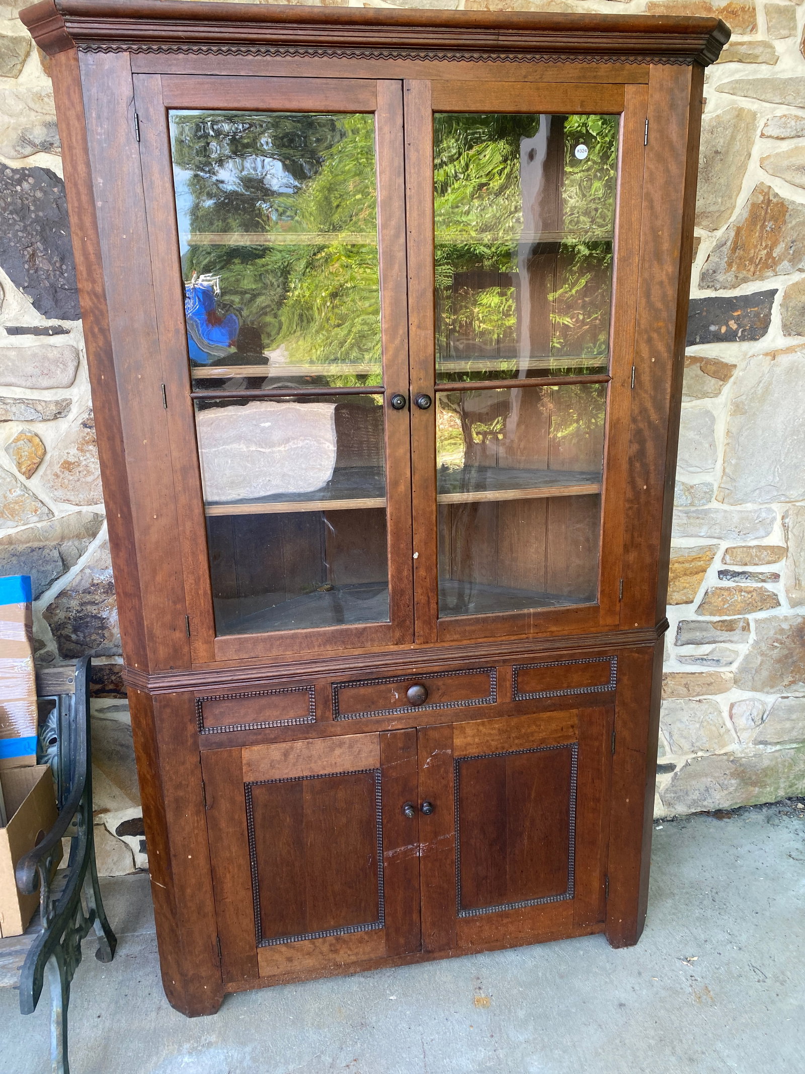 Antique Mahogany Corner Cabinet: One piece. 84" x 50" x 25". Has original wavy glass.